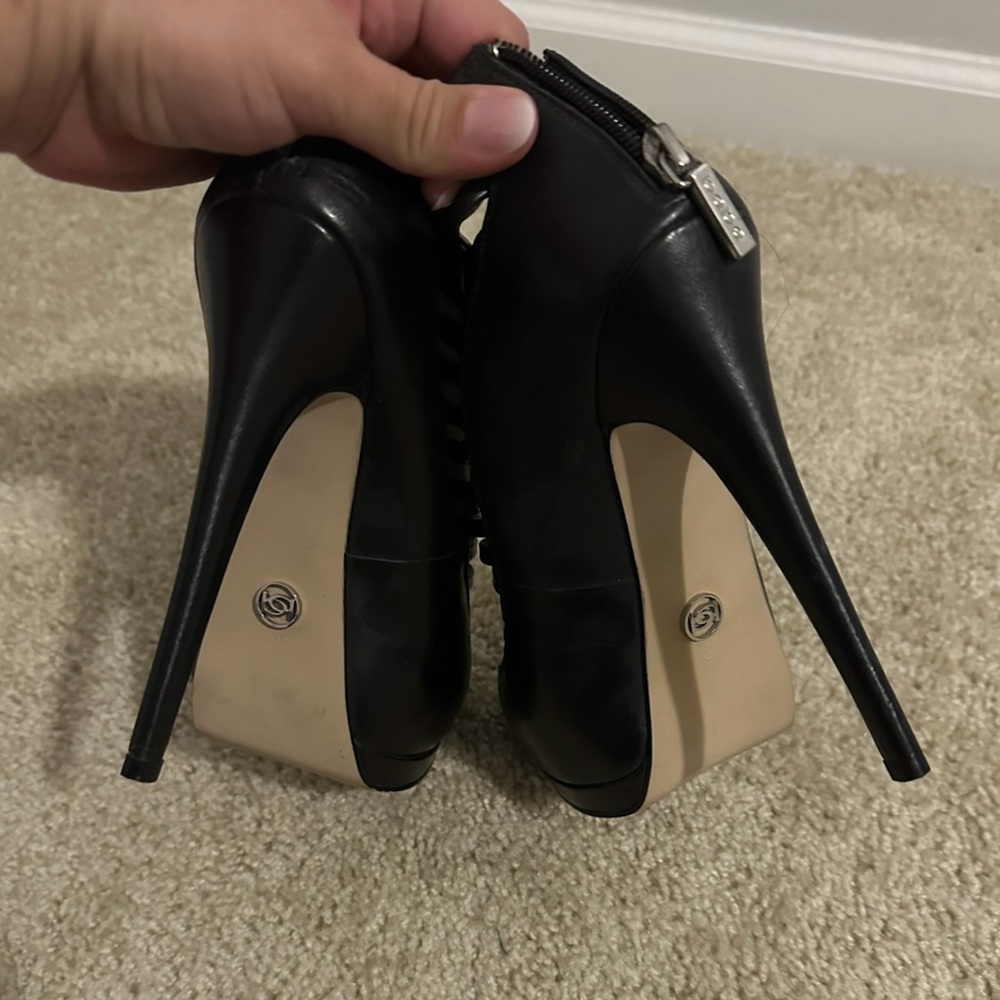 Bebe caged heel. Black heels with a sexy modern twist.